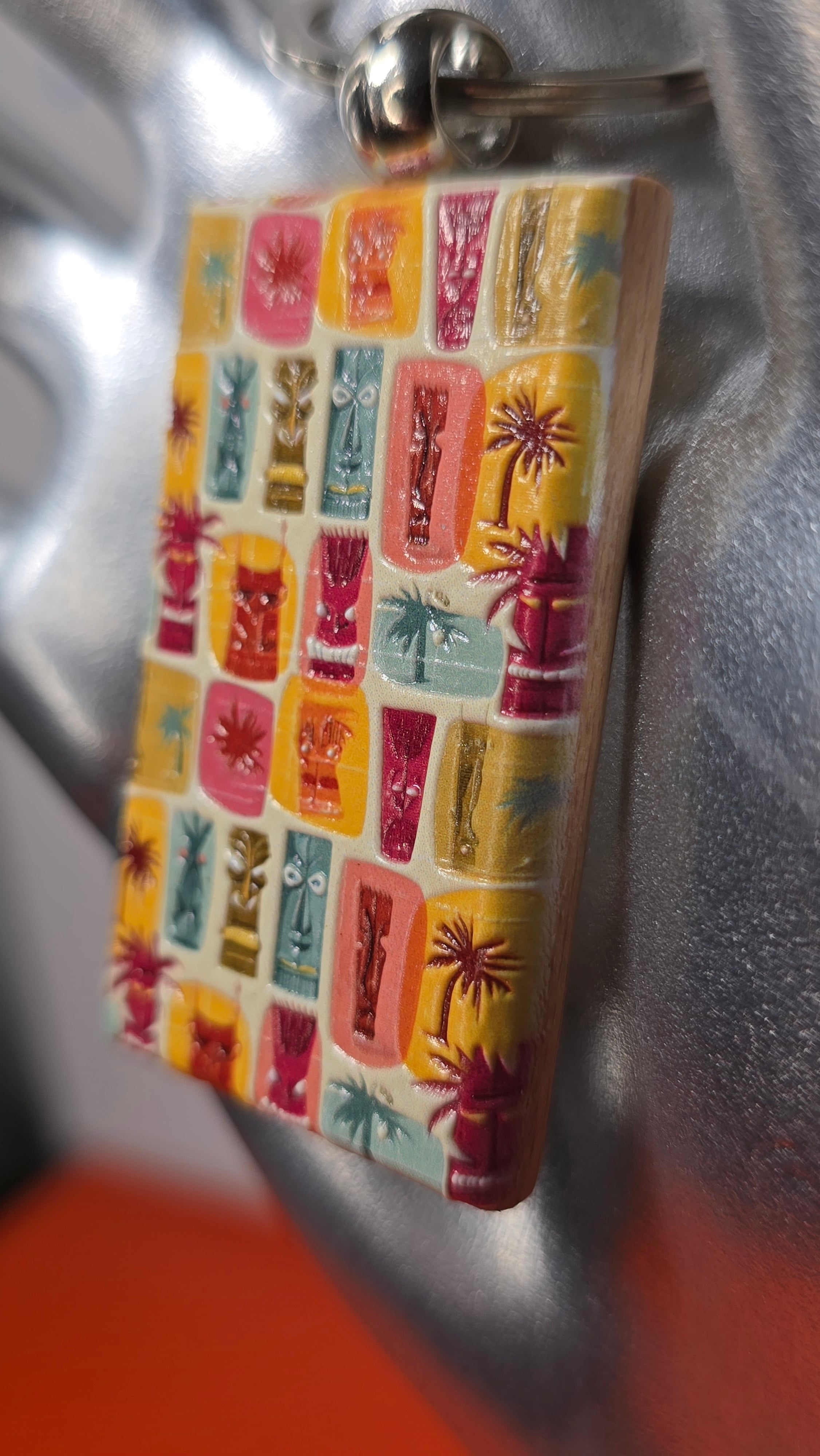 Tiki Faces & Palms Grid Raised Texture Wood Keychain